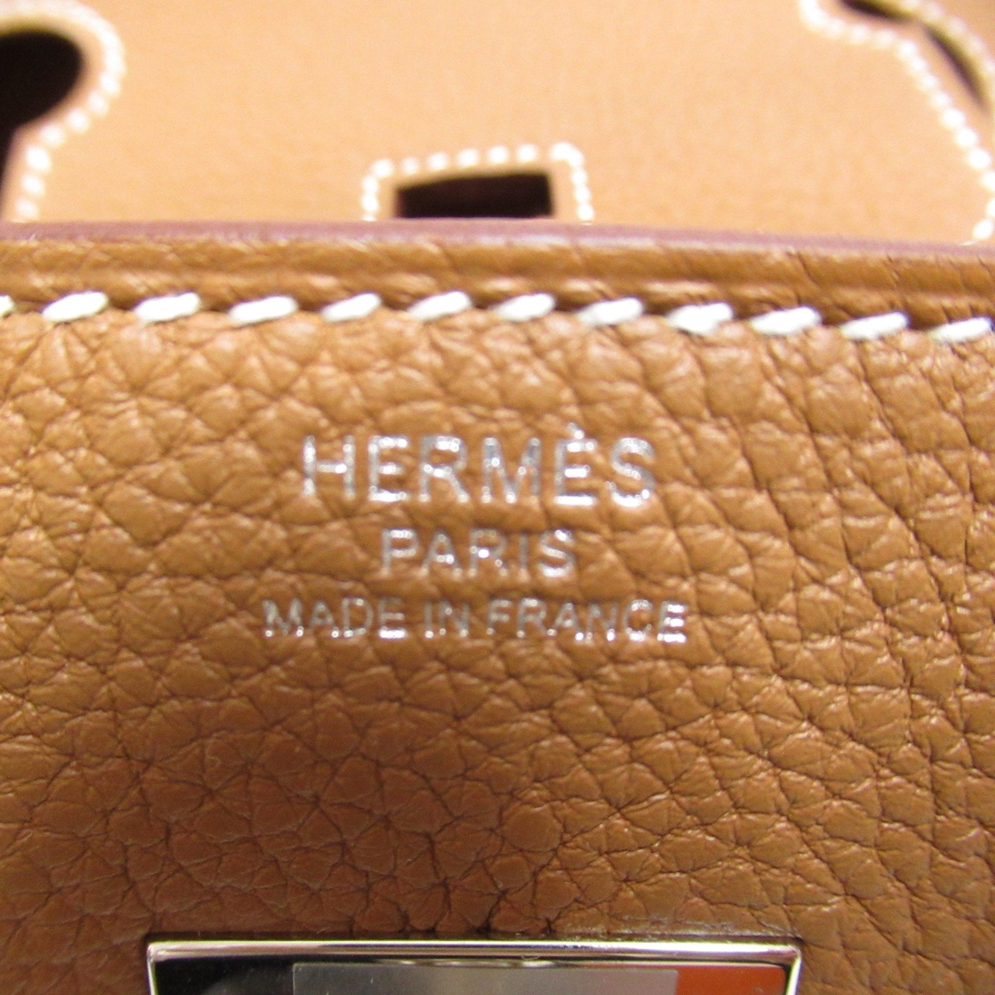Pre-owned Hermes Birkin 30 handbag expertly crafted from Fauve Barenia Faubourg Togo leather and palladium hardware