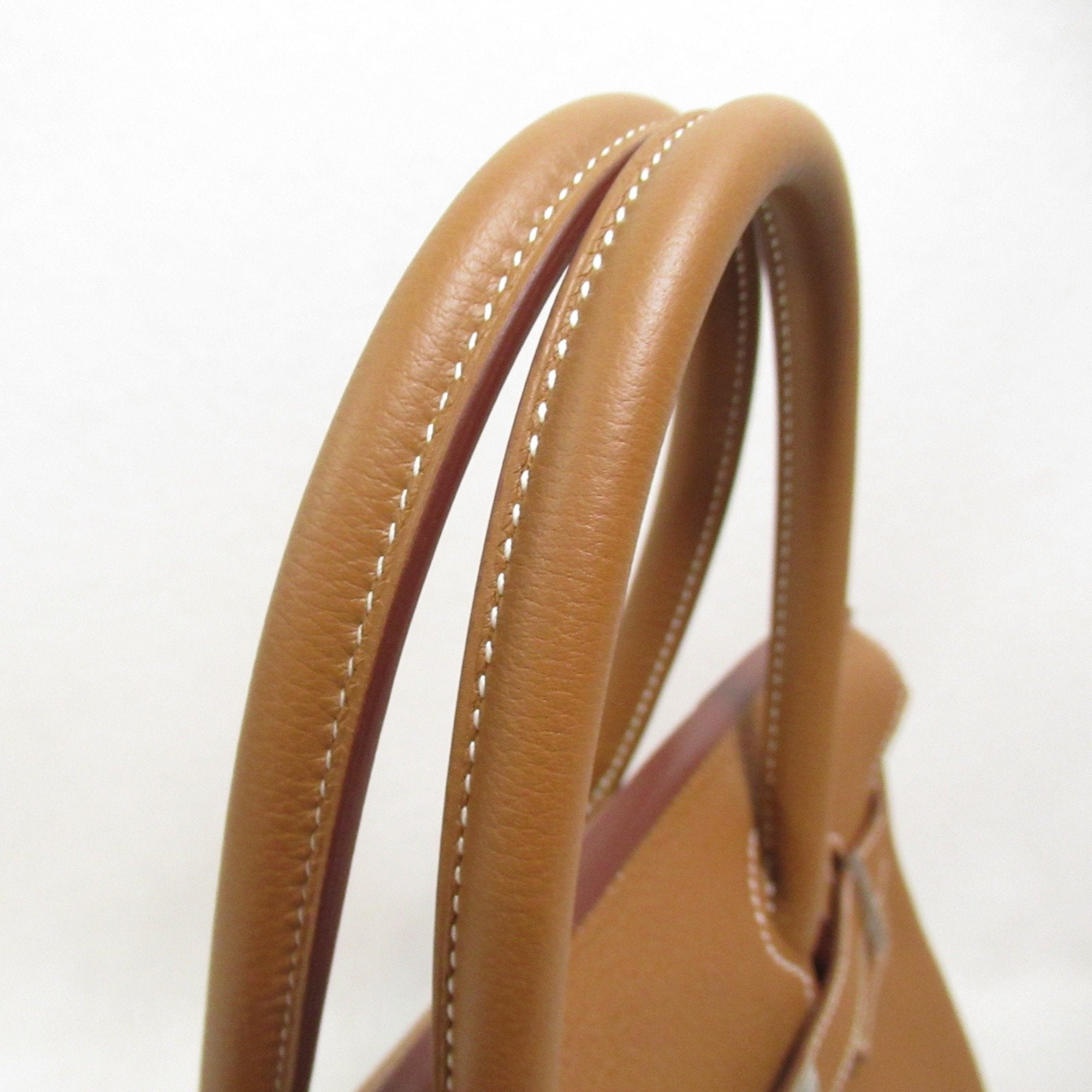 Pre-owned Hermes Birkin 30 handbag expertly crafted from Fauve Barenia Faubourg Togo leather and palladium hardware