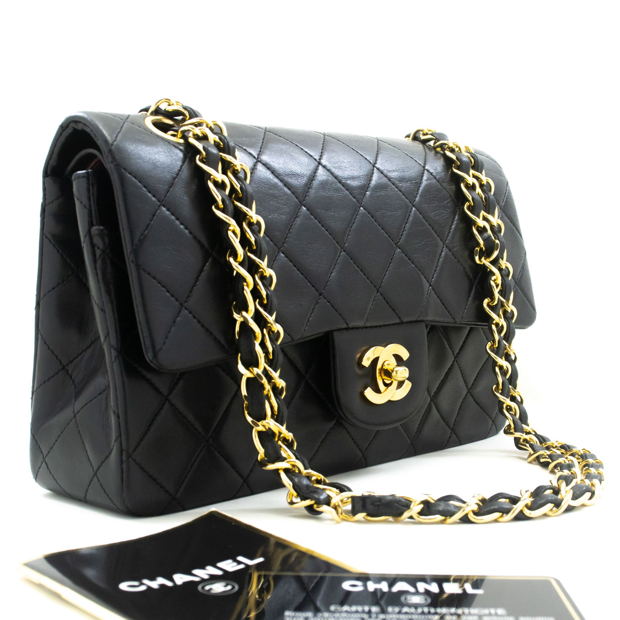 Vintage Chanel Timeless double flap handbag comes in classic black color