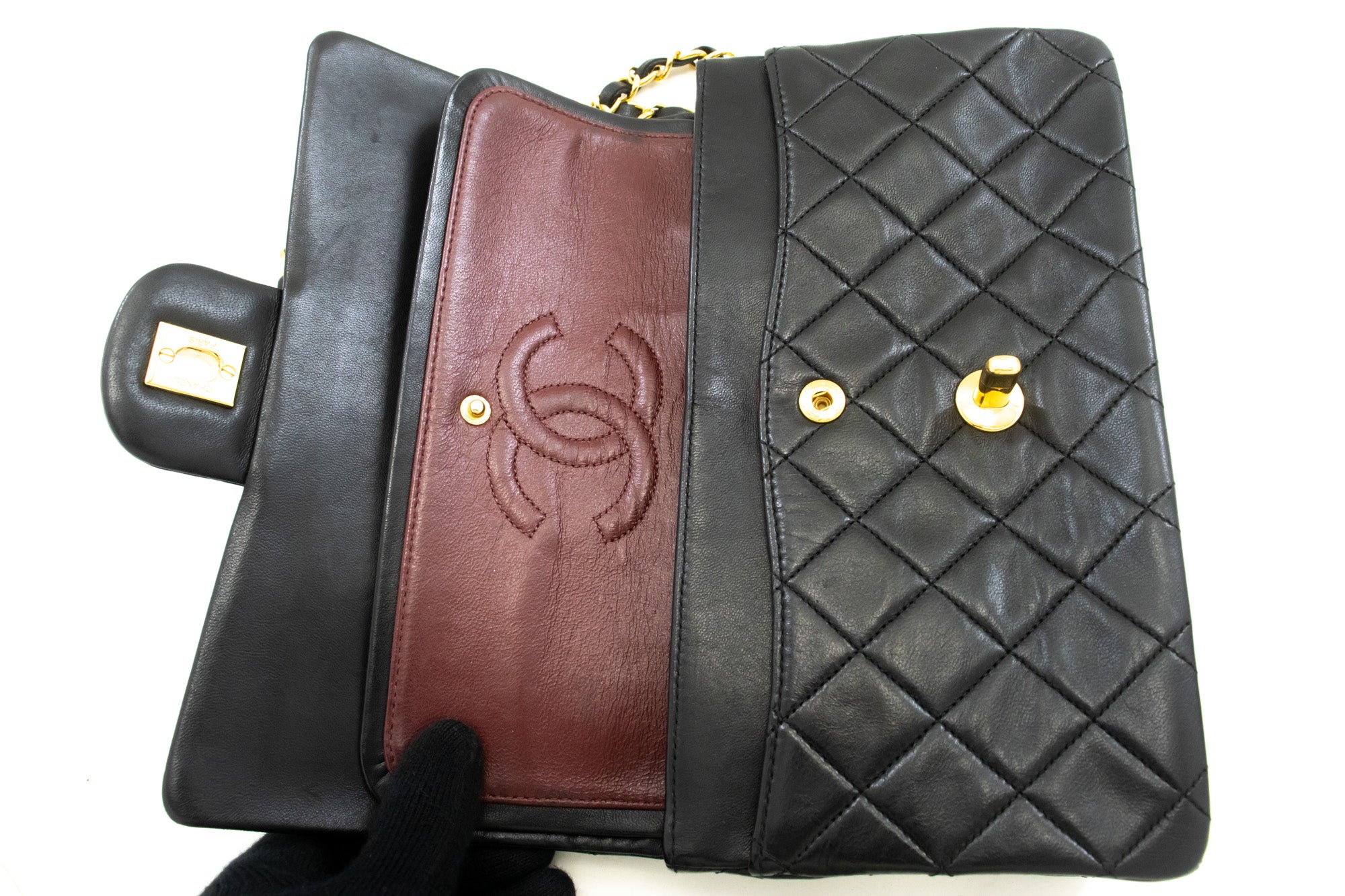 Vintage Chanel Timeless double flap handbag comes in classic black color