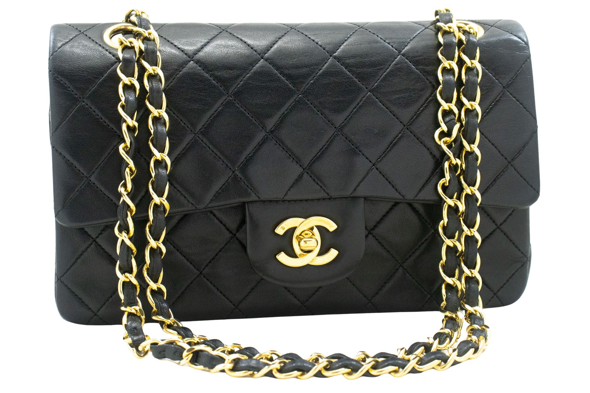 Vintage Chanel Timeless double flap handbag comes in classic black color