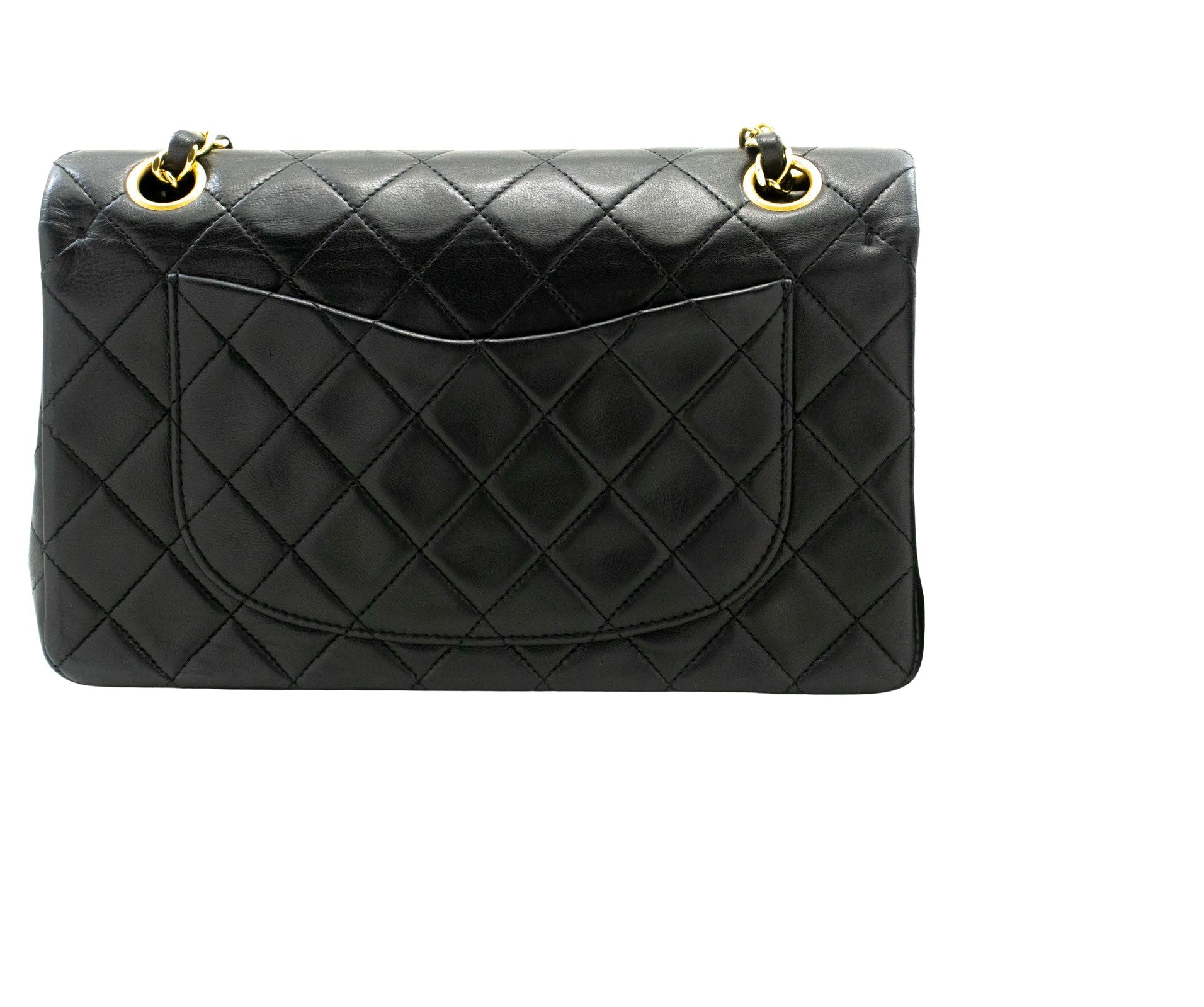 Vintage Chanel Timeless double flap handbag comes in classic black color