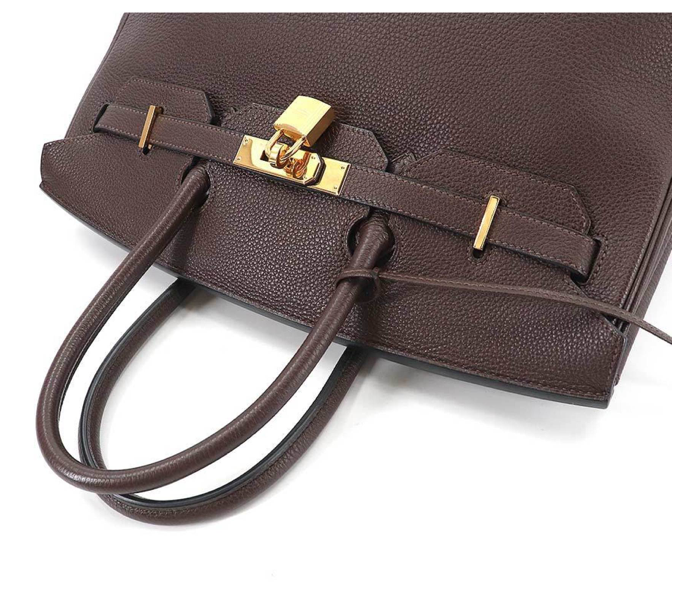 Brown Hermés Birkin 35 leather handbag with accessories