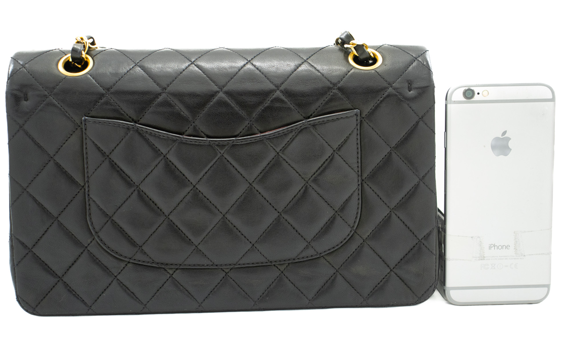 Classic Chanel handbag crafted from luxurious lambskin leather in a black hue