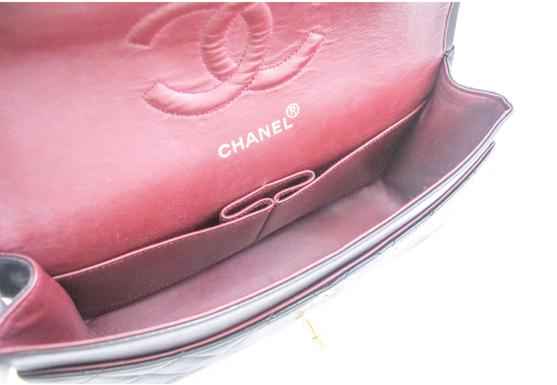 Classic Chanel handbag crafted from luxurious lambskin leather in a black hue