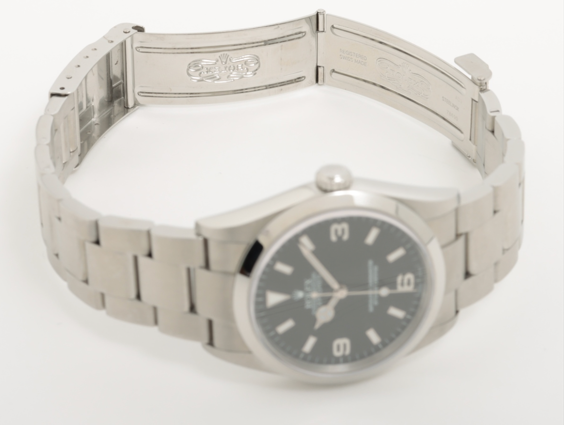 Full set Men's / Unisex stainless steel 36mm Rolex Explorer with a black dial and Arabic numerals. Ref. No. 14270