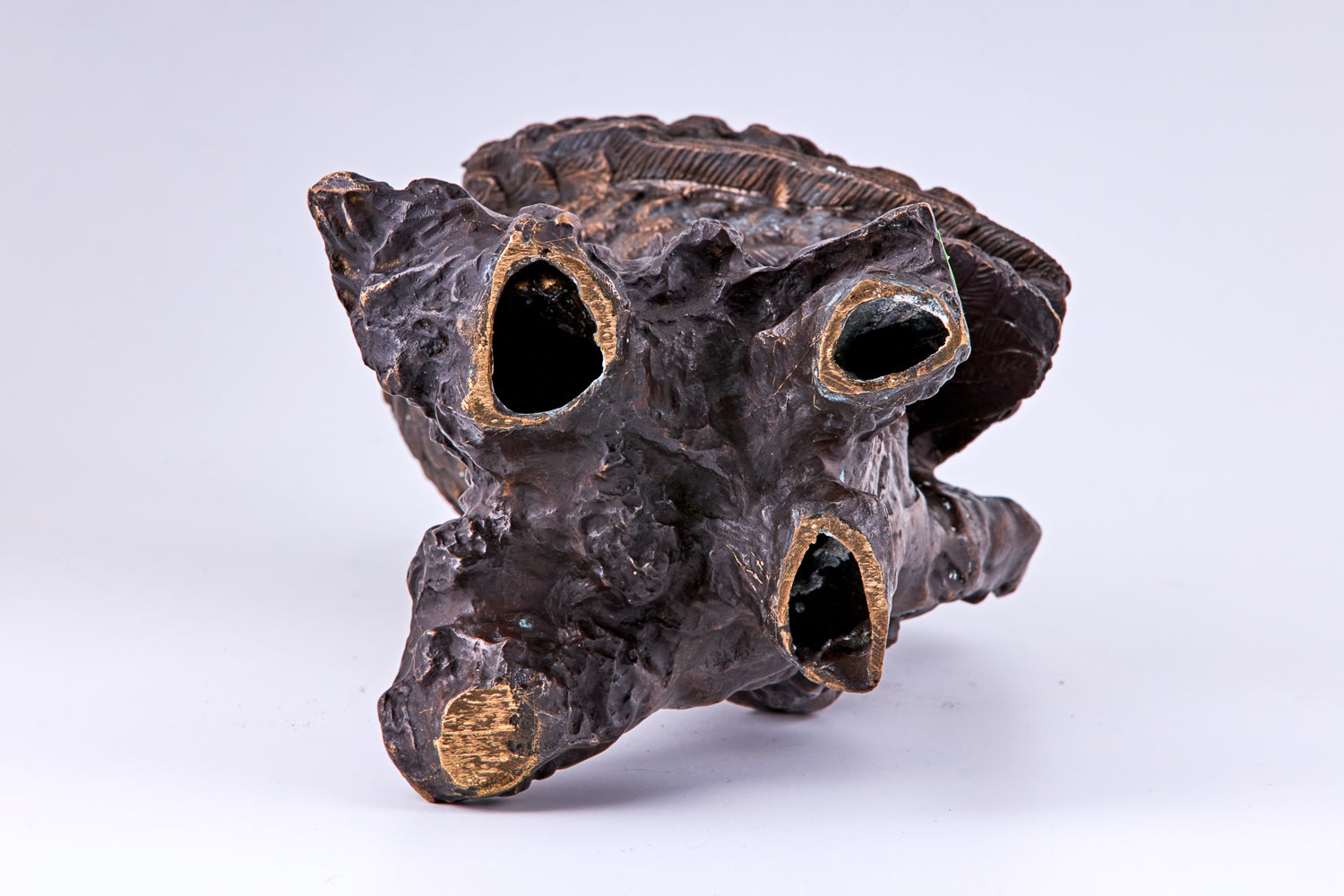 A 19th-century Art Deco sculpture by Dave Russell showcases an owl rendered in patinated bronze