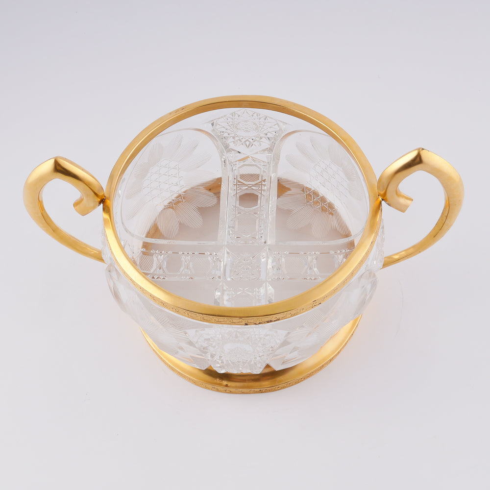 A substantial antique crystal vase features a striking Neogothical design