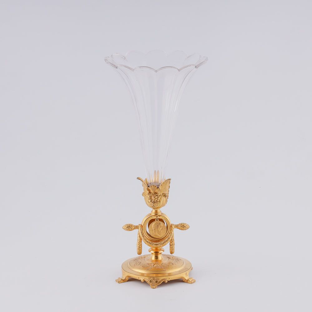 A 19th century crystal vase features two flower-shaped elements elegantly mounted on a giraldical gold-plated bronze plinth