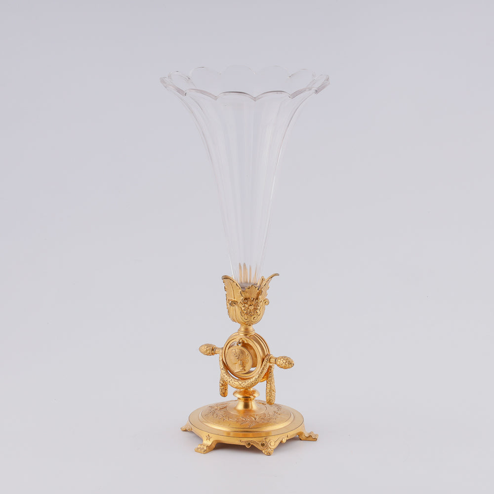 A 19th century crystal vase features two flower-shaped elements elegantly mounted on a giraldical gold-plated bronze plinth