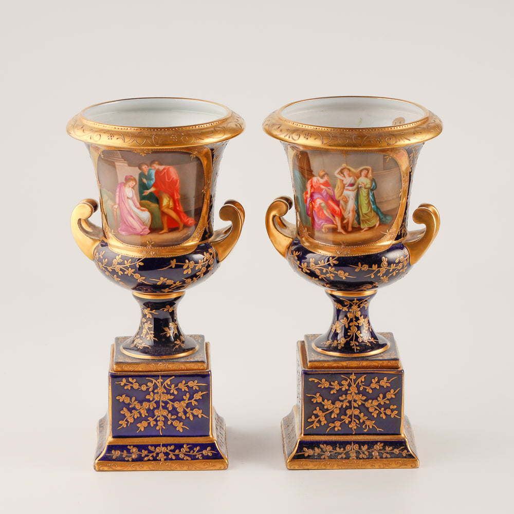 Pair of 19th century Royal Vienna vases features a rich cobalt blue glaze crafted as decorative salon porcelain