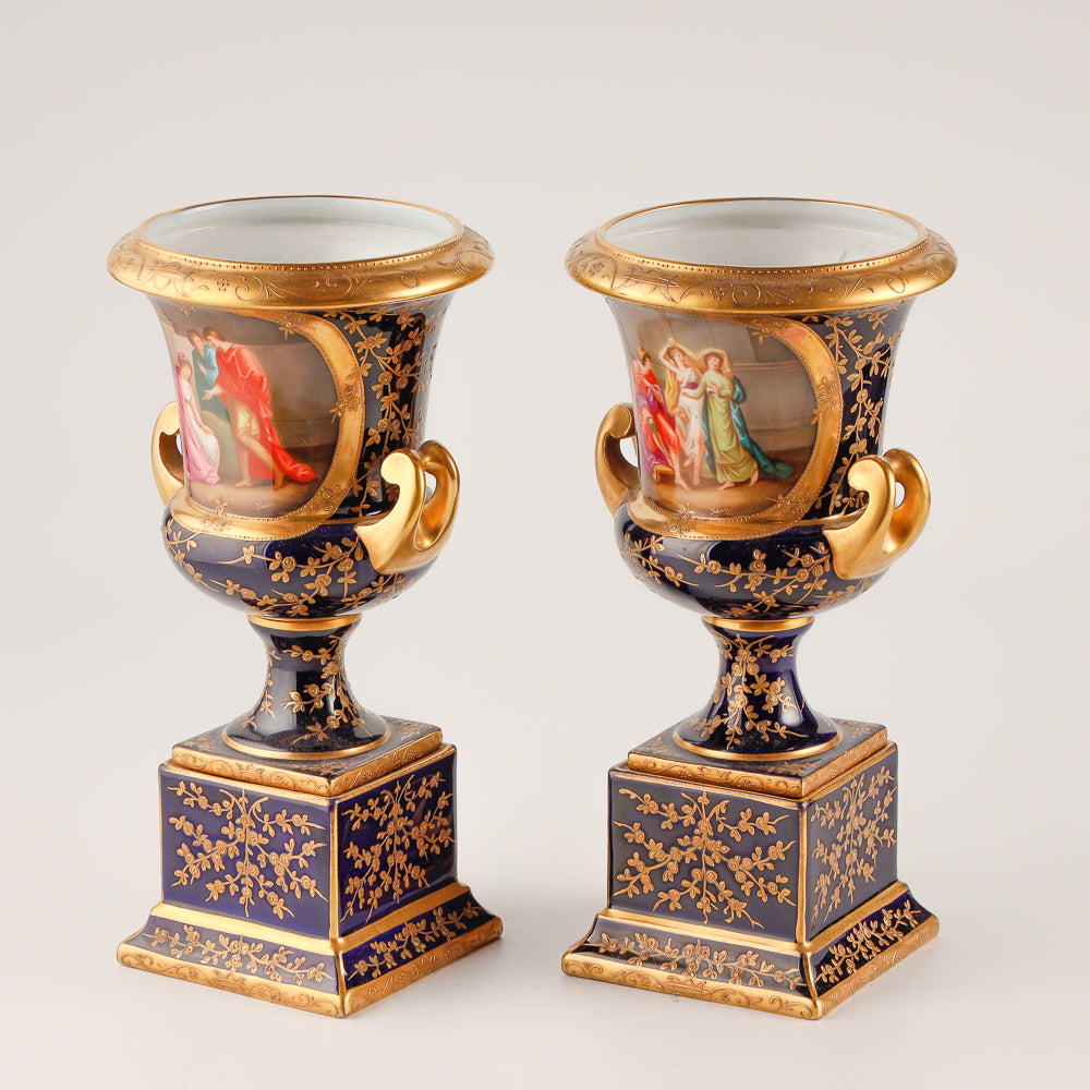 Pair of 19th century Royal Vienna vases features a rich cobalt blue glaze crafted as decorative salon porcelain