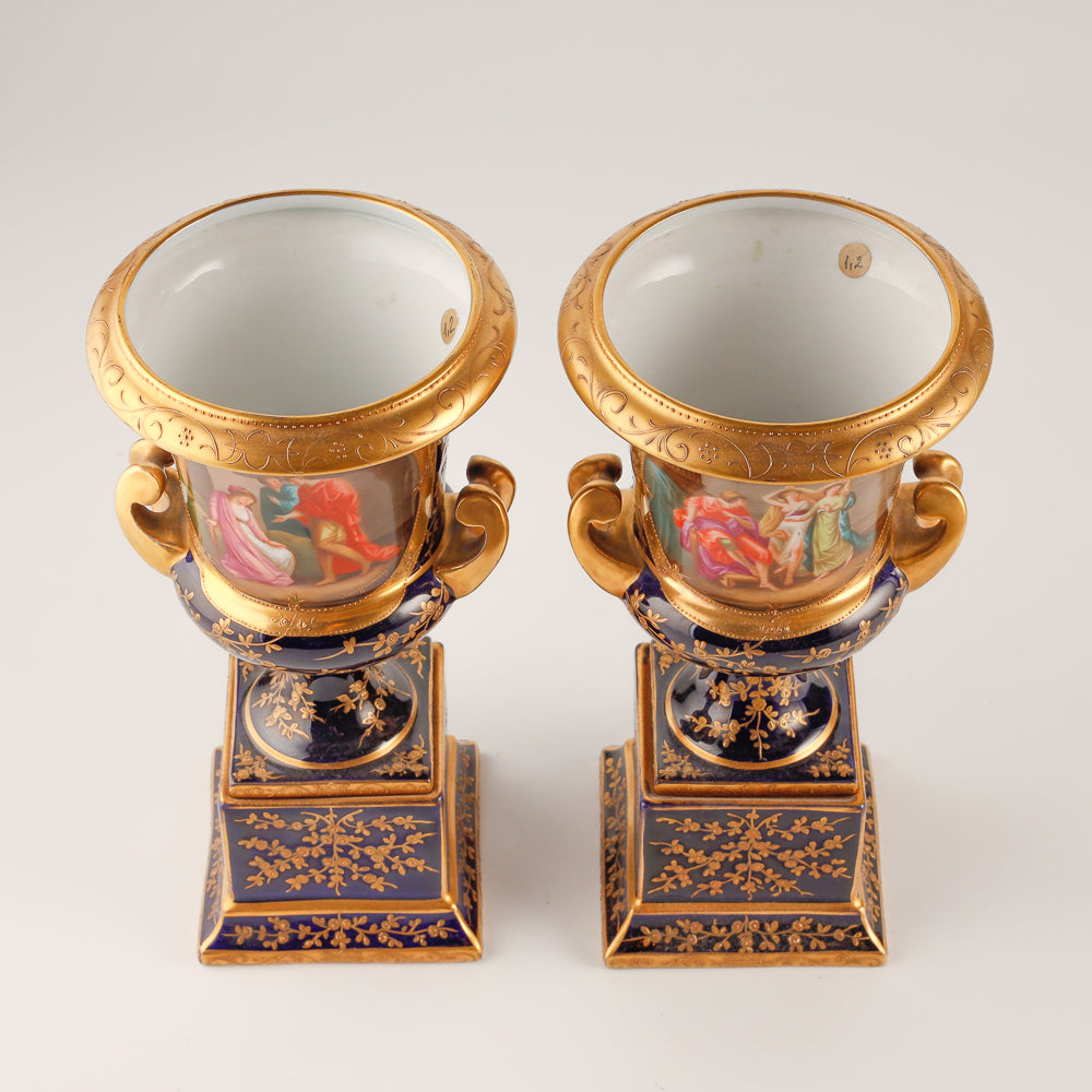 Pair of 19th century Royal Vienna vases features a rich cobalt blue glaze crafted as decorative salon porcelain