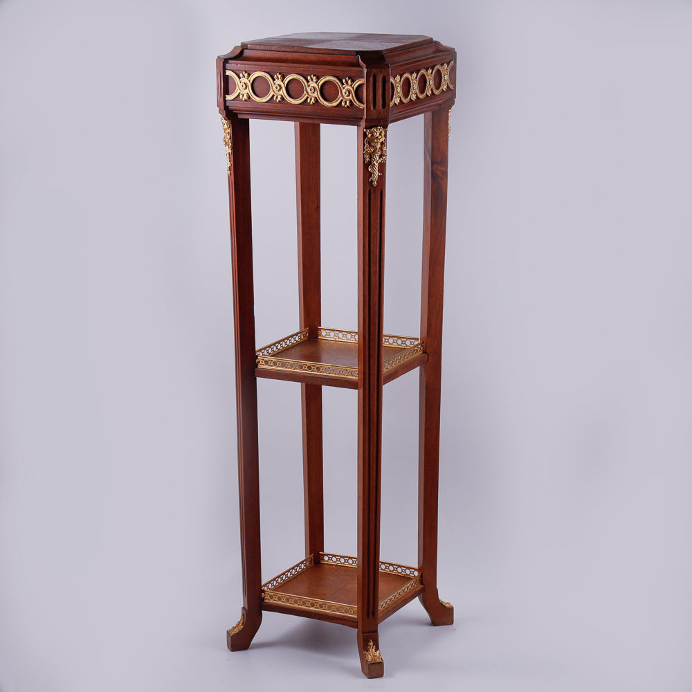 Mahagony hand-carved console with gold-painted Neoclassical decorative ornaments.