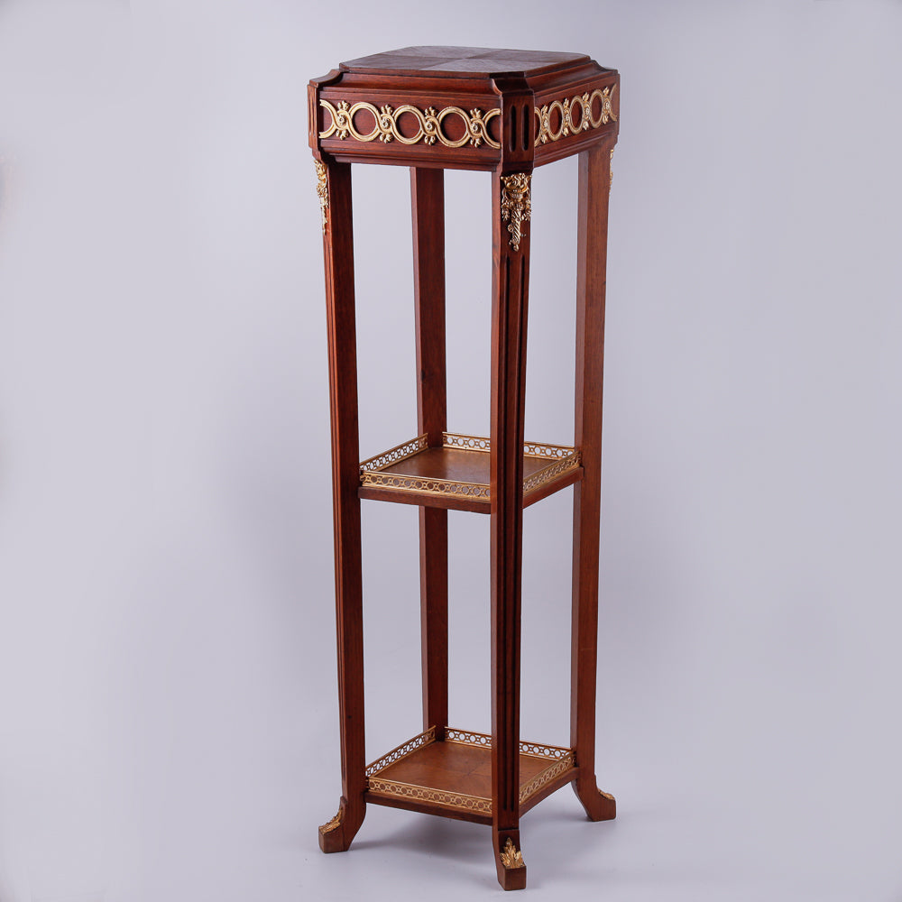 Mahagony hand-carved console with gold-painted Neoclassical decorative ornaments.