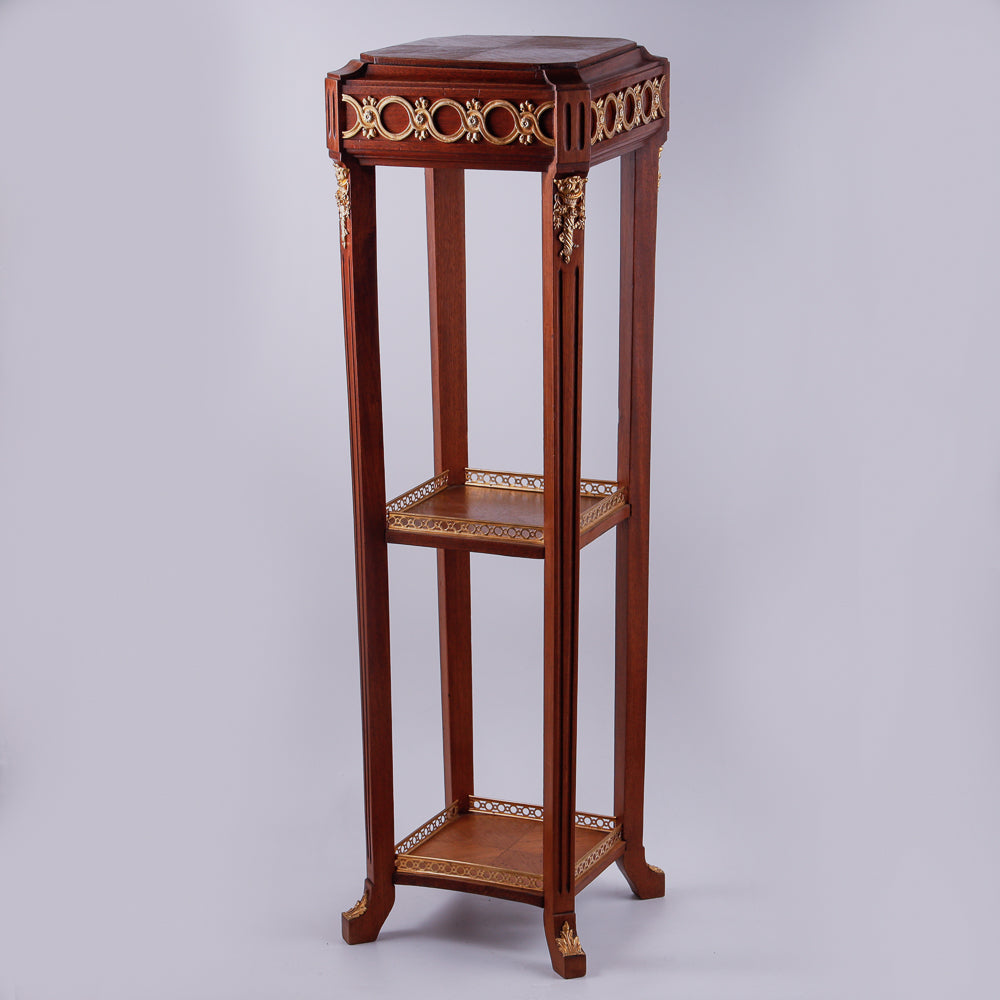 Mahagony hand-carved console with gold-painted Neoclassical decorative ornaments.