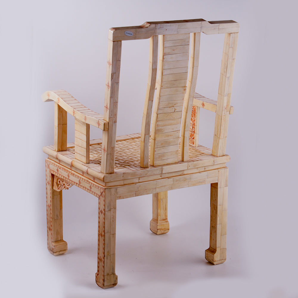 Pair of large ivory armchairs showcases intricate Asian inlay motifs