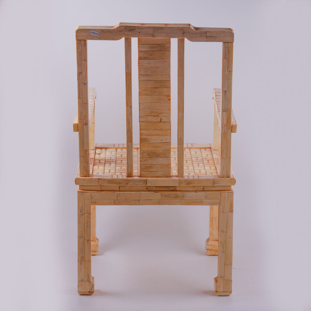 Pair of large ivory armchairs showcases intricate Asian inlay motifs