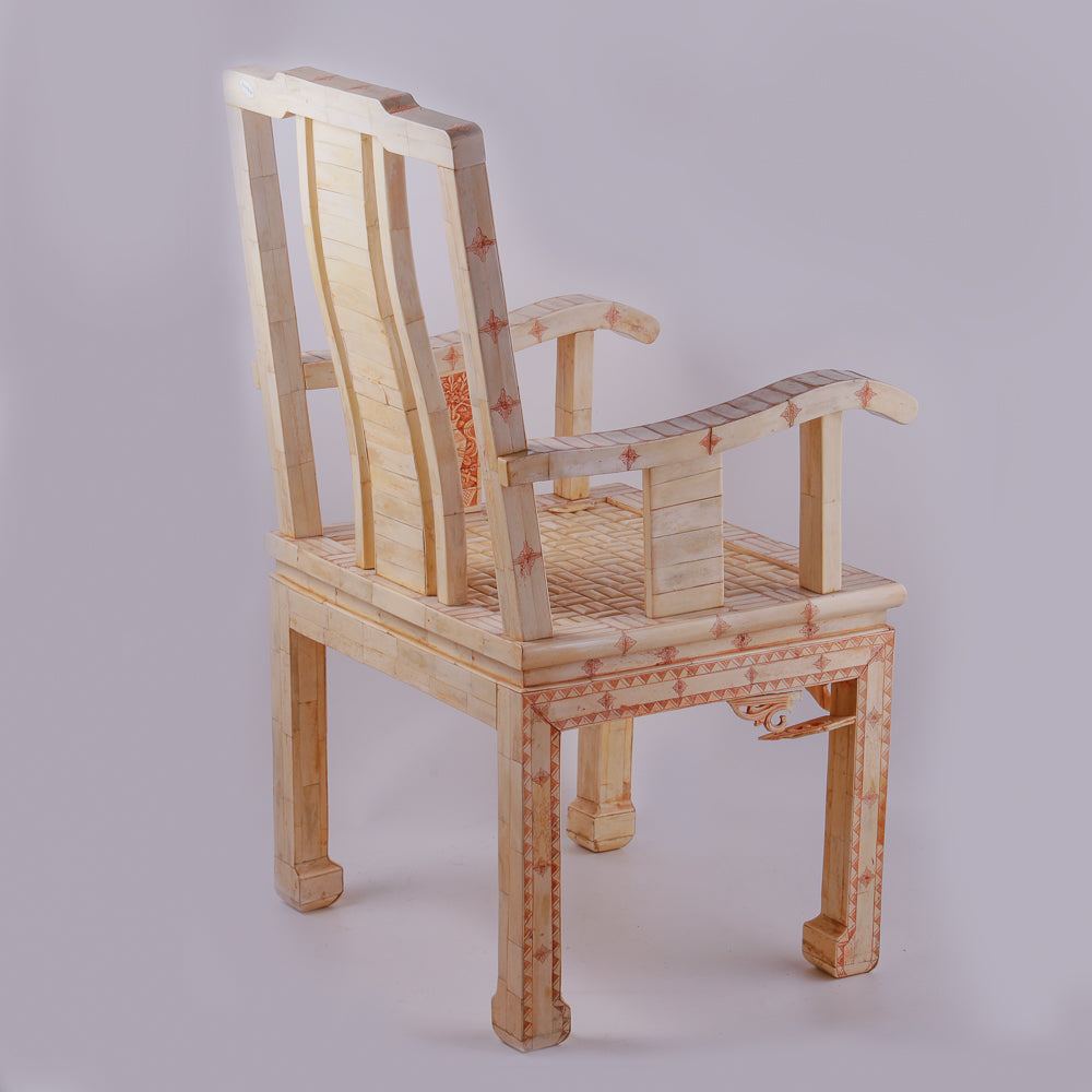 Pair of large ivory armchairs showcases intricate Asian inlay motifs