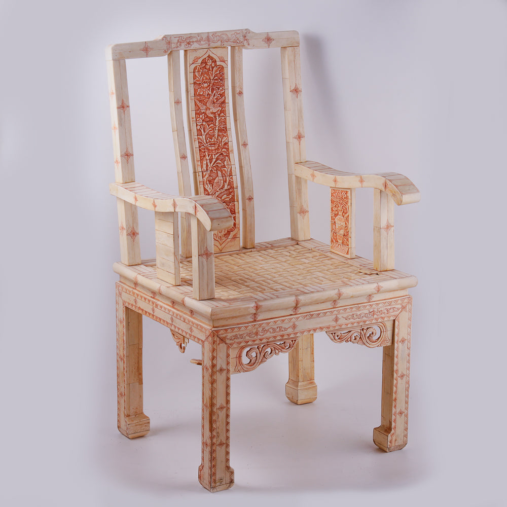 Pair of large ivory armchairs showcases intricate Asian inlay motifs