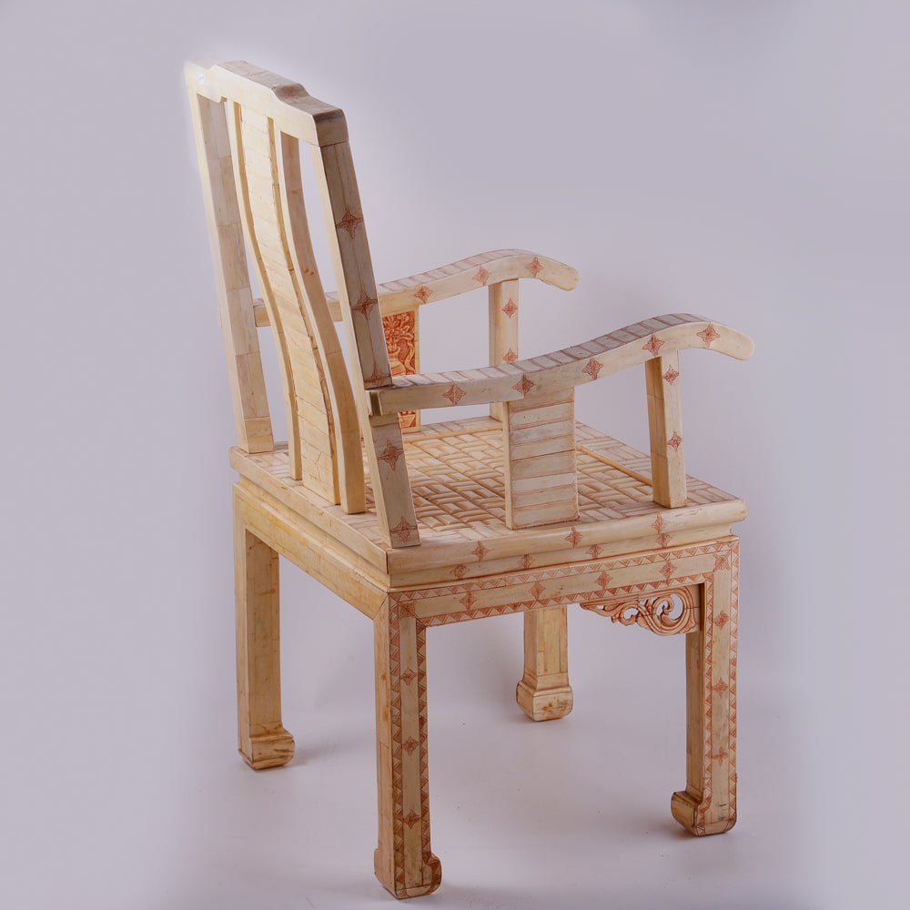Pair of large ivory armchairs showcases intricate Asian inlay motifs