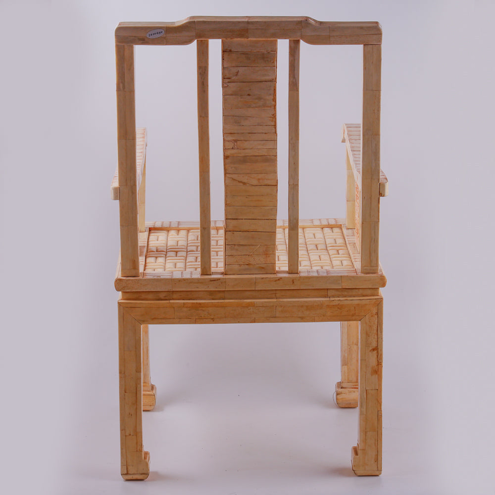 Pair of large ivory armchairs showcases intricate Asian inlay motifs