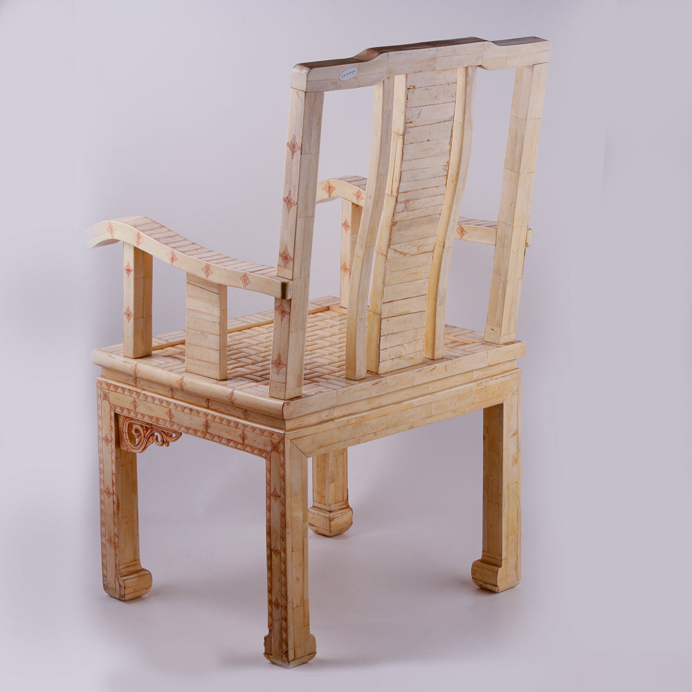 Pair of large ivory armchairs showcases intricate Asian inlay motifs