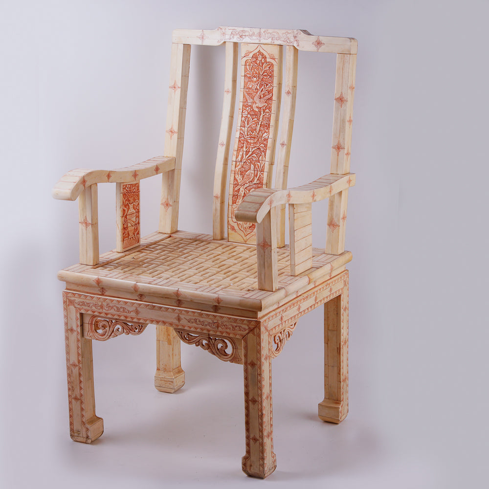 Pair of large ivory armchairs showcases intricate Asian inlay motifs