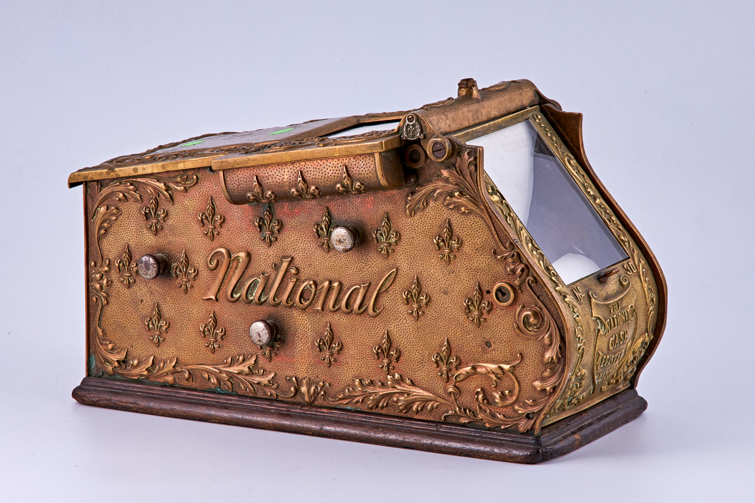 antique portable brass cash register, signed “The National Cash Register Payton O. U.S.A.” by “National”