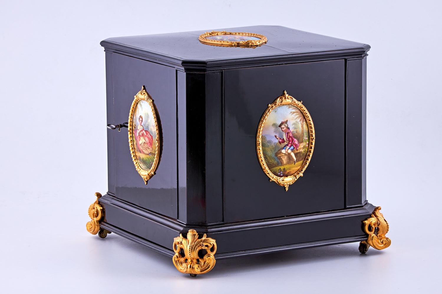 Antique 19th-century Napoleon III ebony cabinet featuring finely detailed Sèvres porcelain plaques