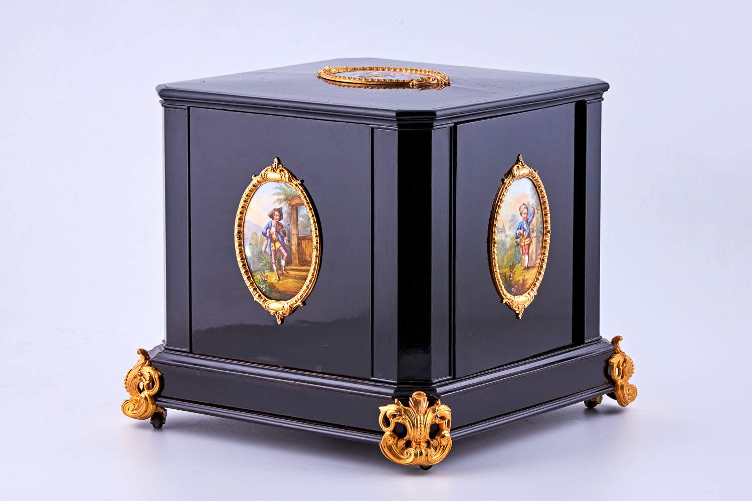 Antique 19th-century Napoleon III ebony cabinet featuring finely detailed Sèvres porcelain plaques