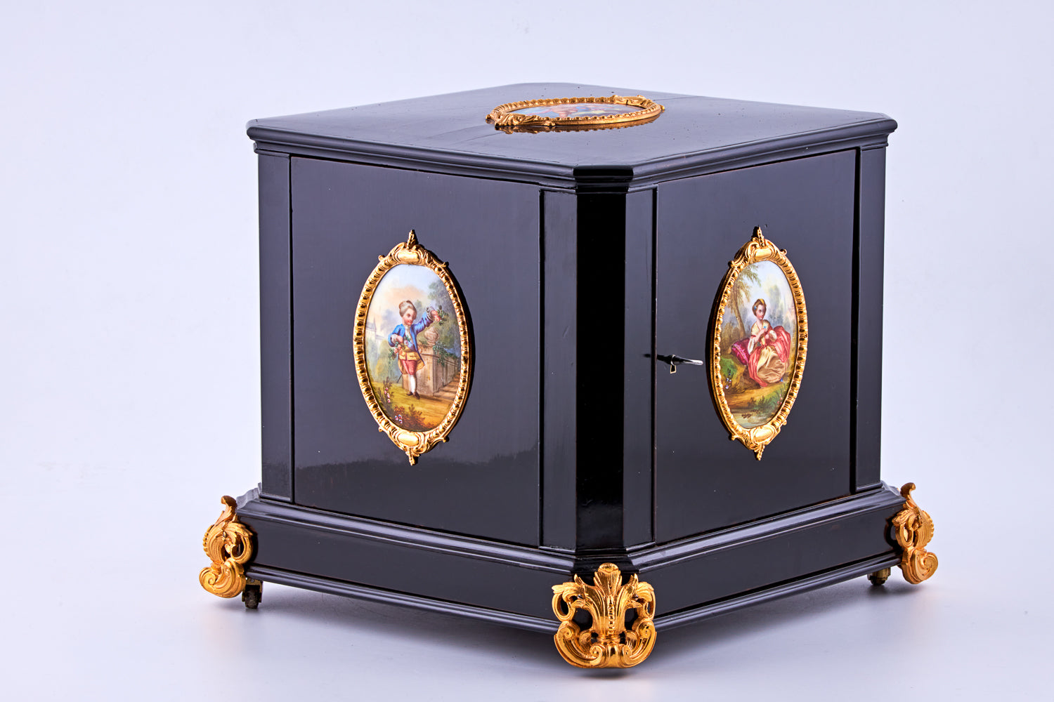 Antique 19th-century Napoleon III ebony cabinet featuring finely detailed Sèvres porcelain plaques
