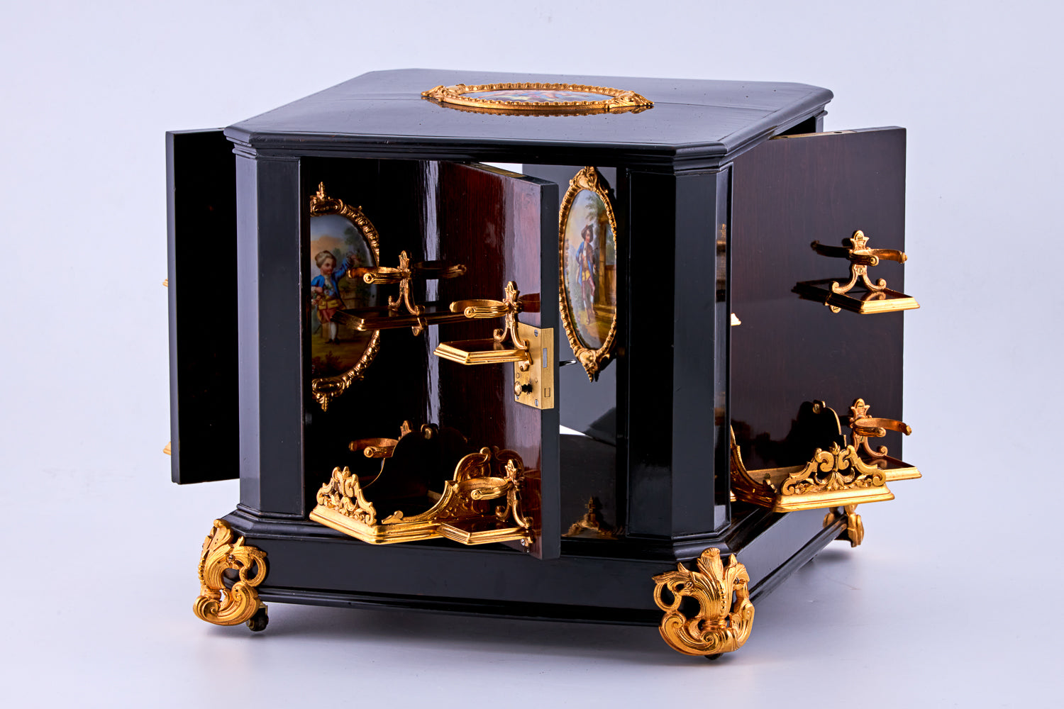 Antique 19th-century Napoleon III ebony cabinet featuring finely detailed Sèvres porcelain plaques