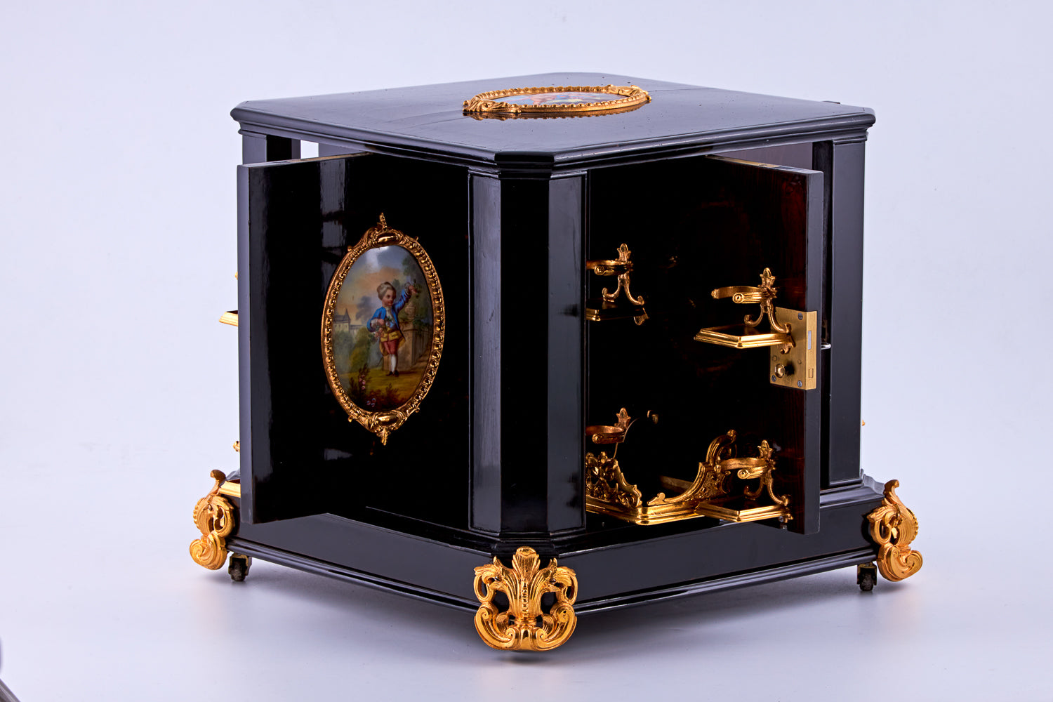 Antique 19th-century Napoleon III ebony cabinet featuring finely detailed Sèvres porcelain plaques