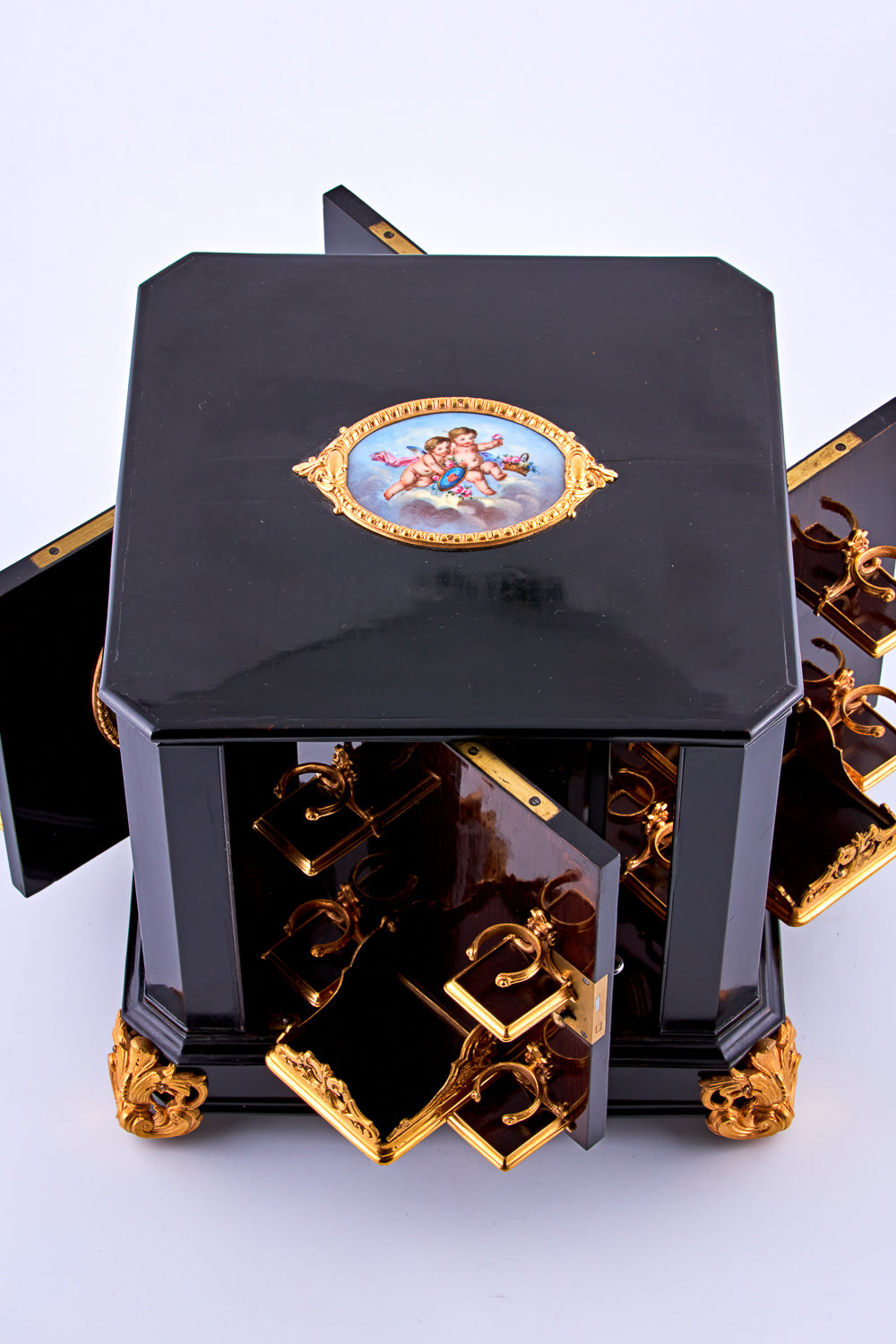 Antique 19th-century Napoleon III ebony cabinet featuring finely detailed Sèvres porcelain plaques