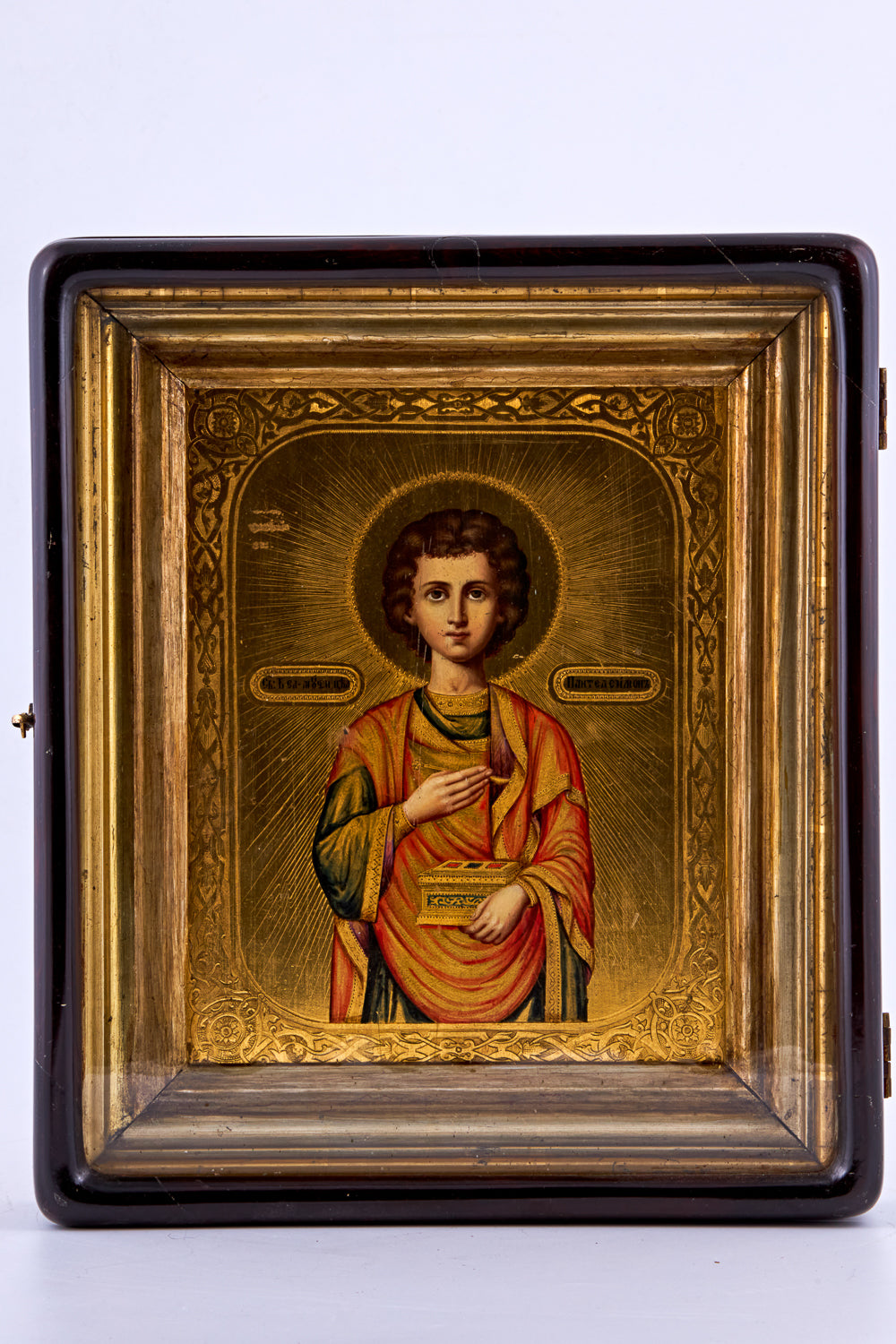Icon of Saint Panteleon features hand-painted tempera colors and authentic gold leaf applied on cypress wood