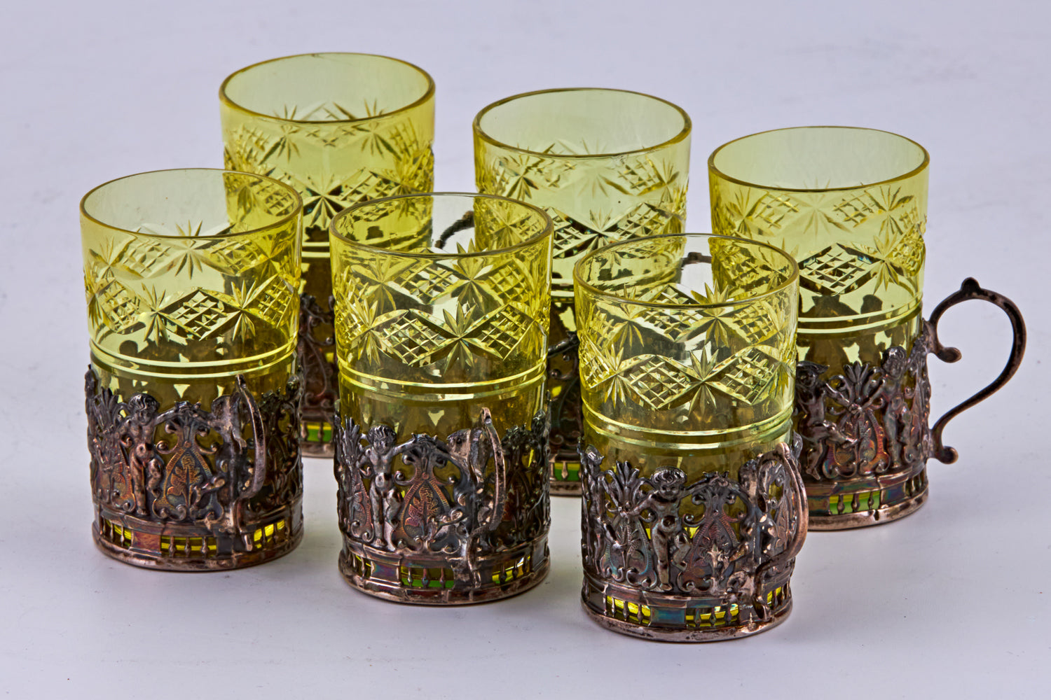 Antique set features a coloured crystal carafe accompanied by six crystal cups