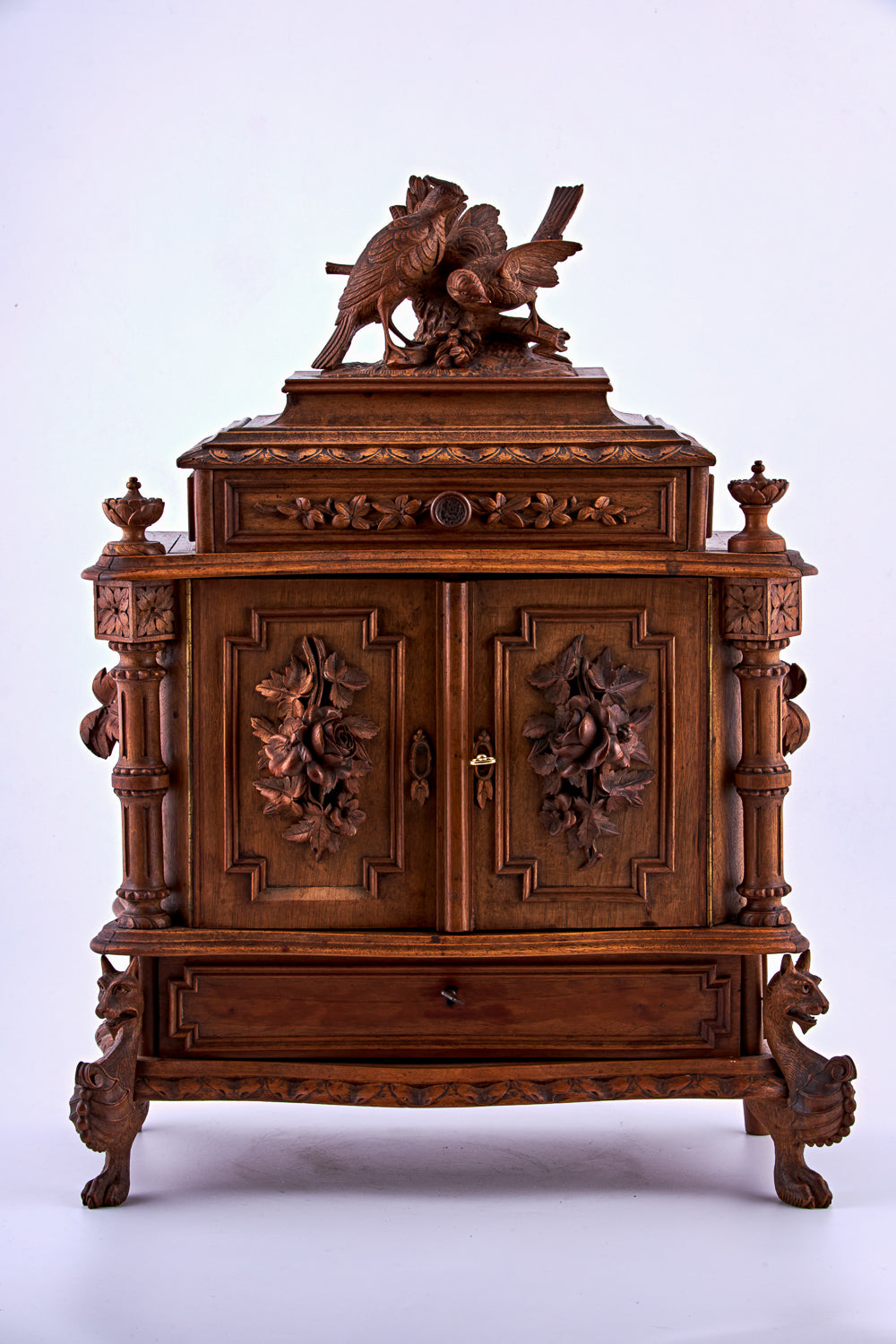 A 19th-century hand-carved wooden jewelry box featuring ten carefully designed drawers