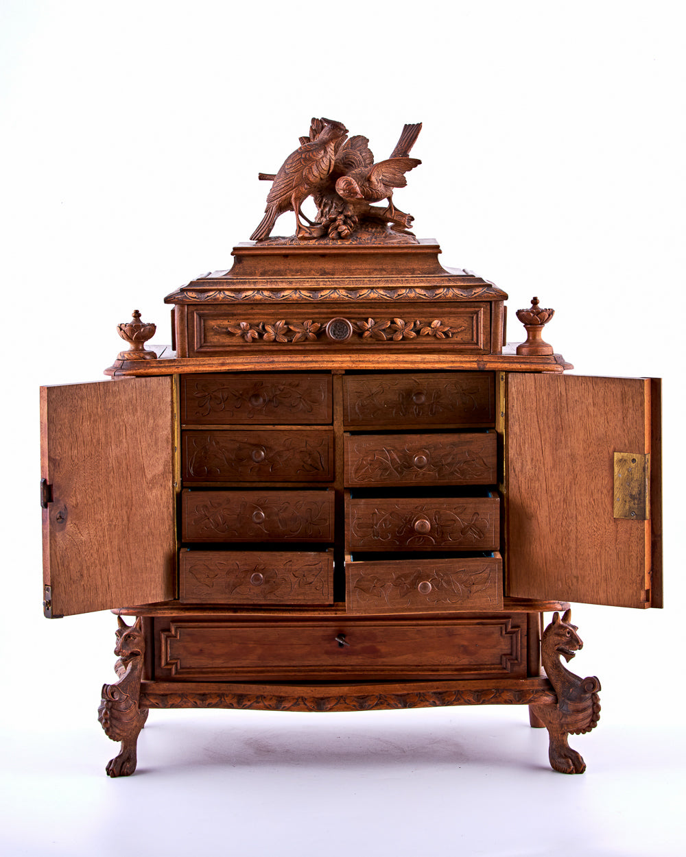 A 19th-century hand-carved wooden jewelry box featuring ten carefully designed drawers