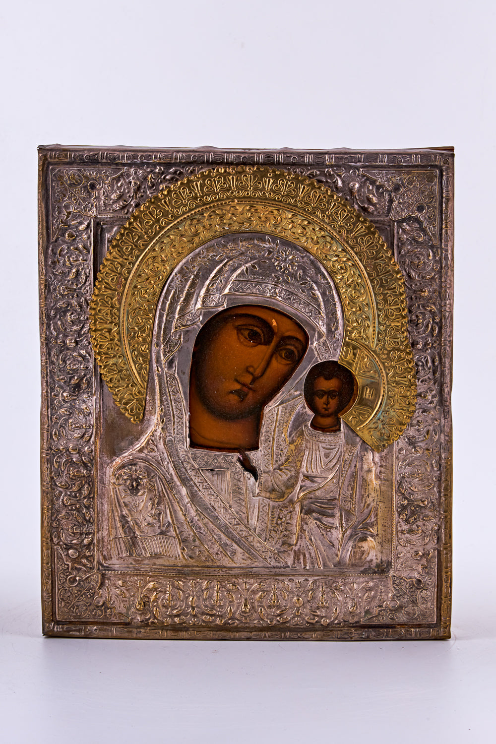 Antique hand-painted tempera icon on wood features “Our Lady of Kazan”