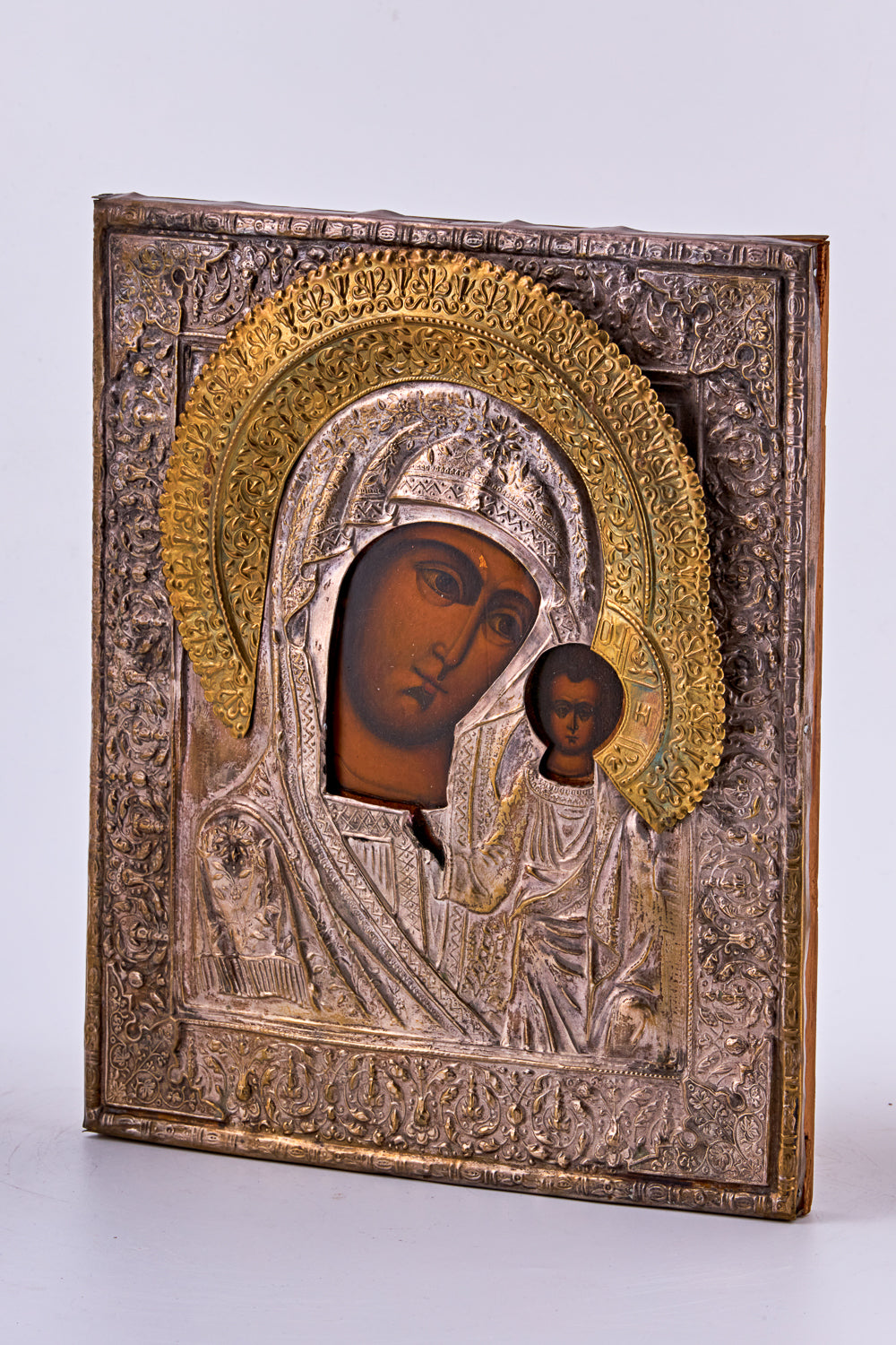 Antique hand-painted tempera icon on wood features “Our Lady of Kazan”