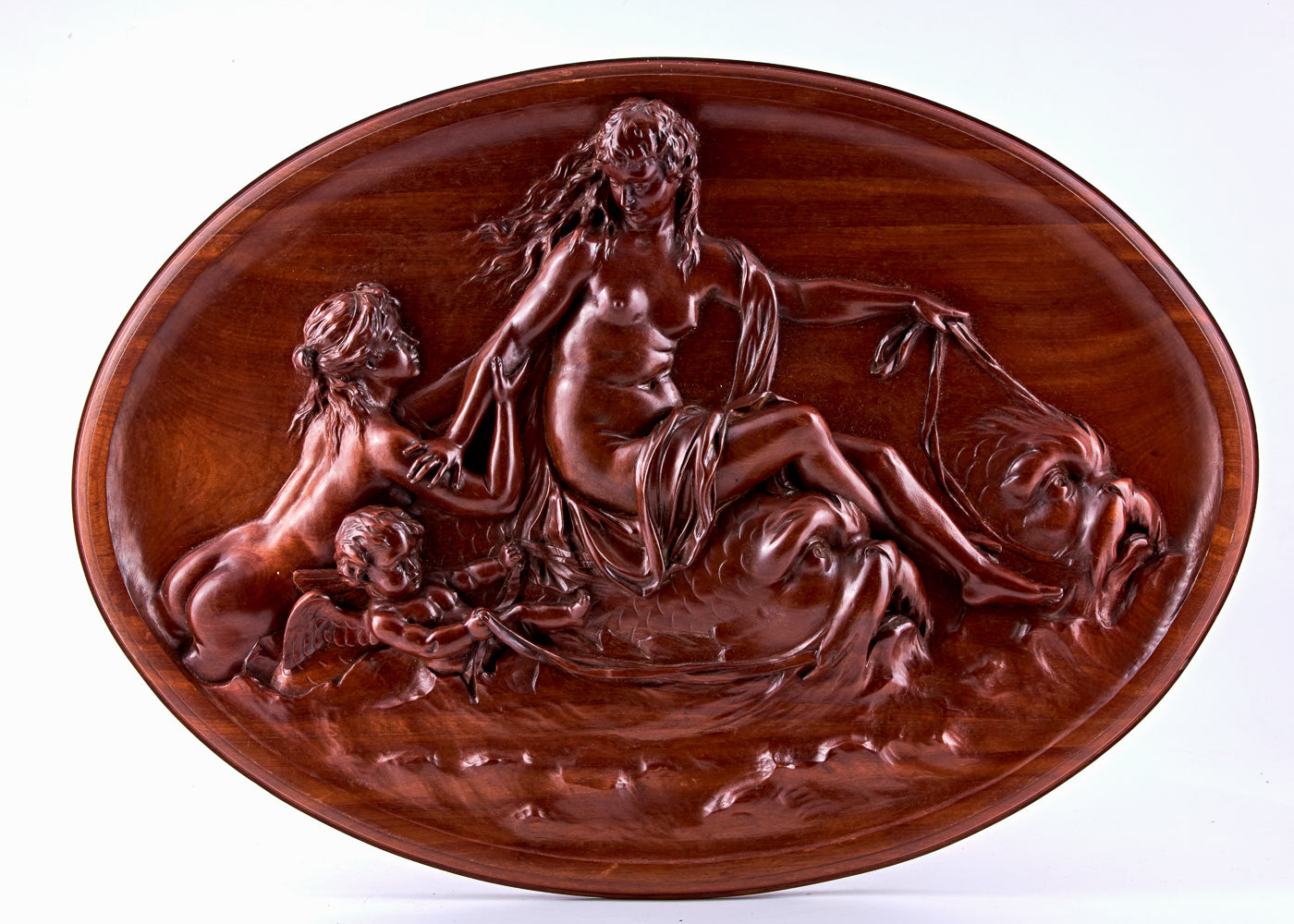 Vintage mahogany panel from the early 1900s that illustrates a mythological allegory