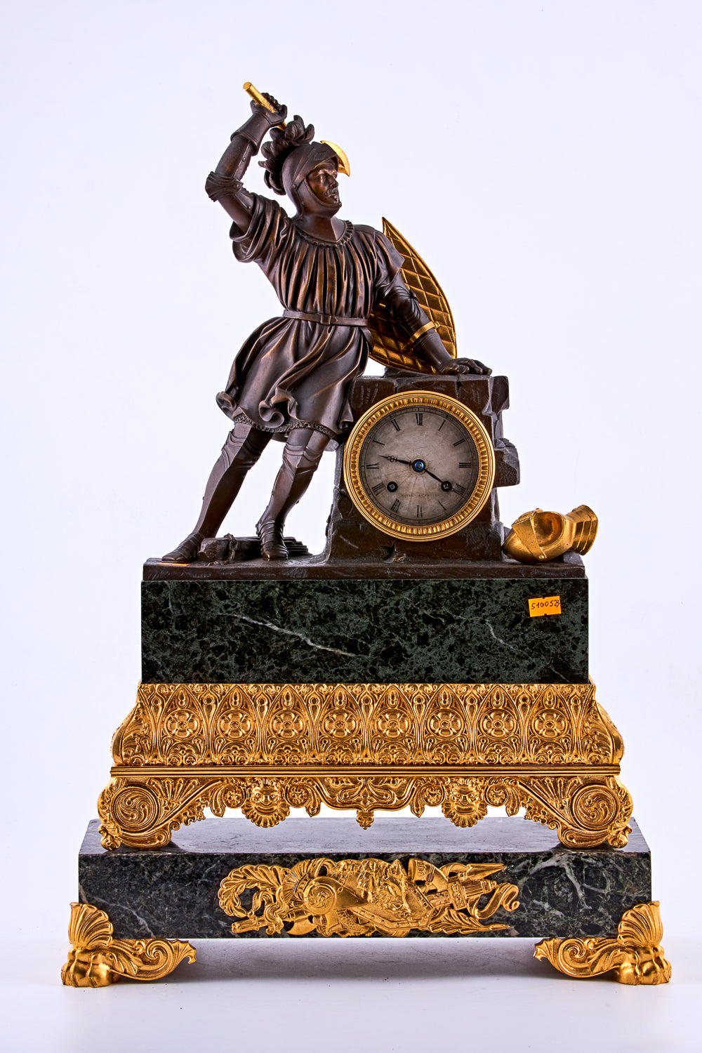 late 19th-century neoclassical clock features a finely crafted gilt bronze figurine of a knight