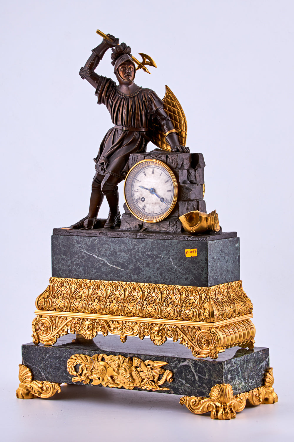 late 19th-century neoclassical clock features a finely crafted gilt bronze figurine of a knight