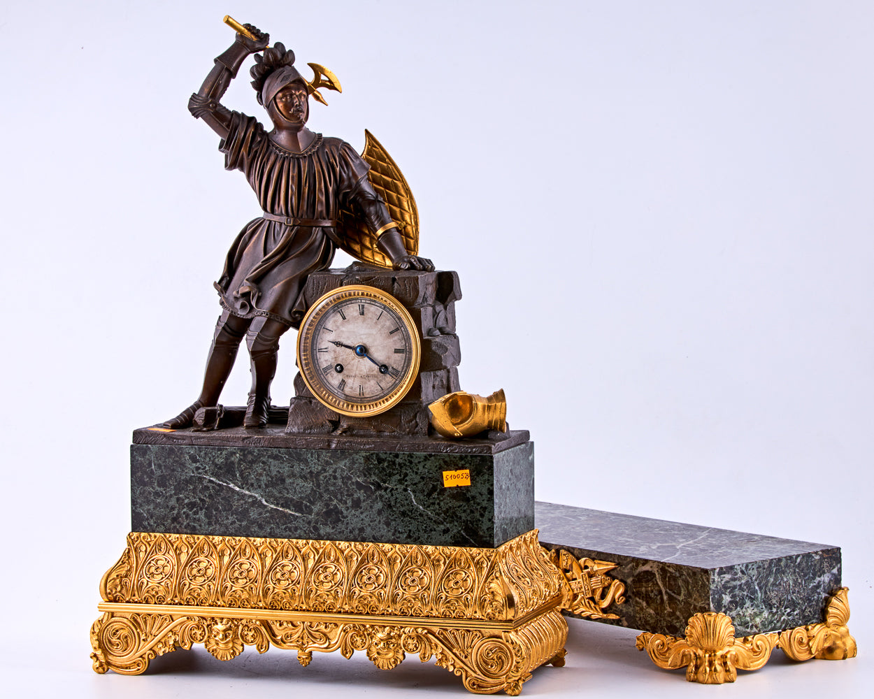 late 19th-century neoclassical clock features a finely crafted gilt bronze figurine of a knight