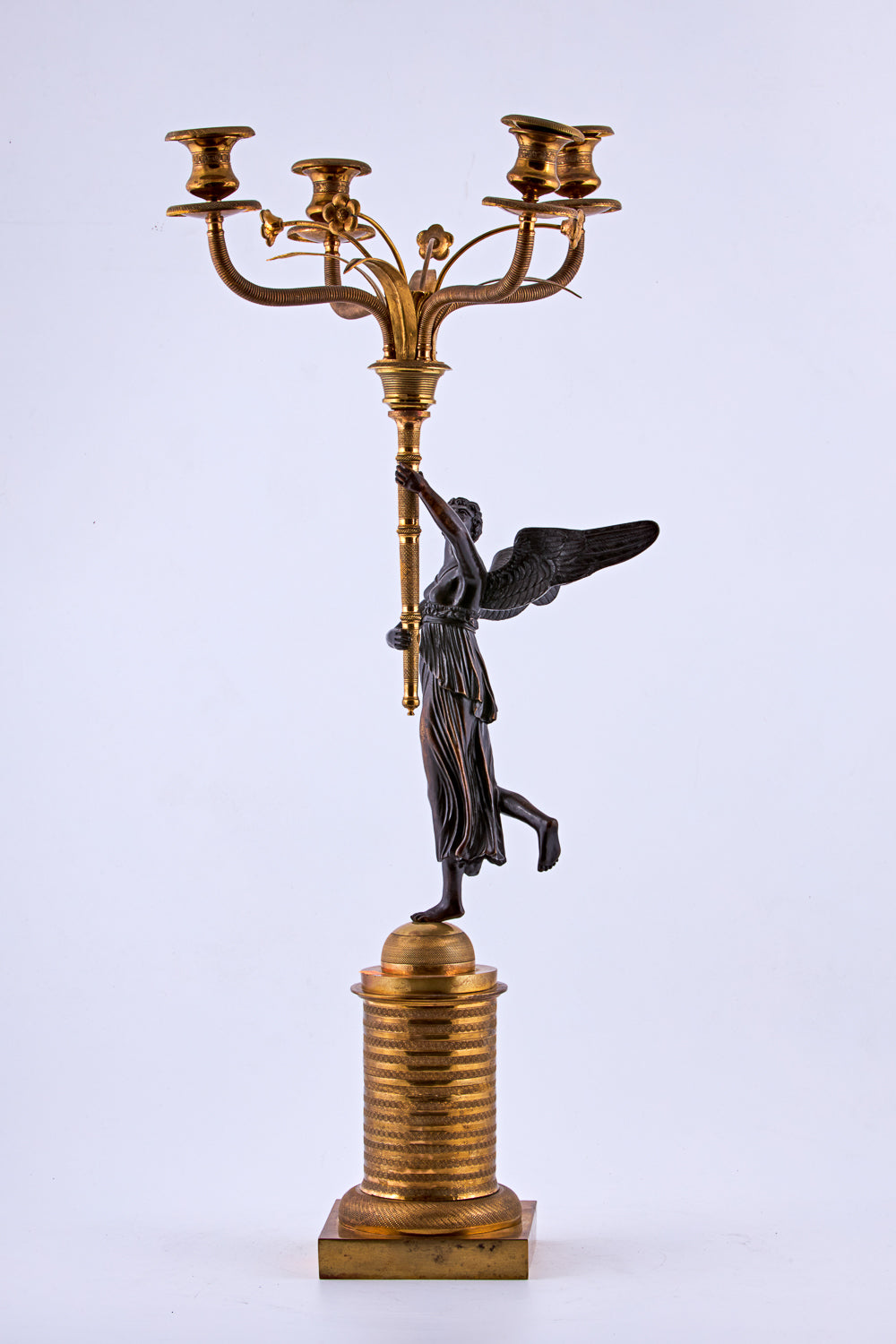 Candelabra from the late 19th century is crafted in bronze with a gold-plated finish