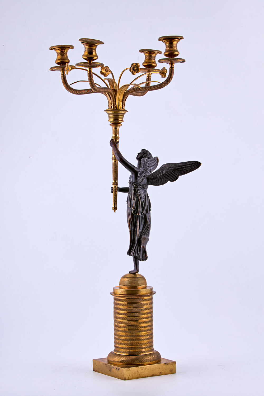 Candelabra from the late 19th century is crafted in bronze with a gold-plated finish