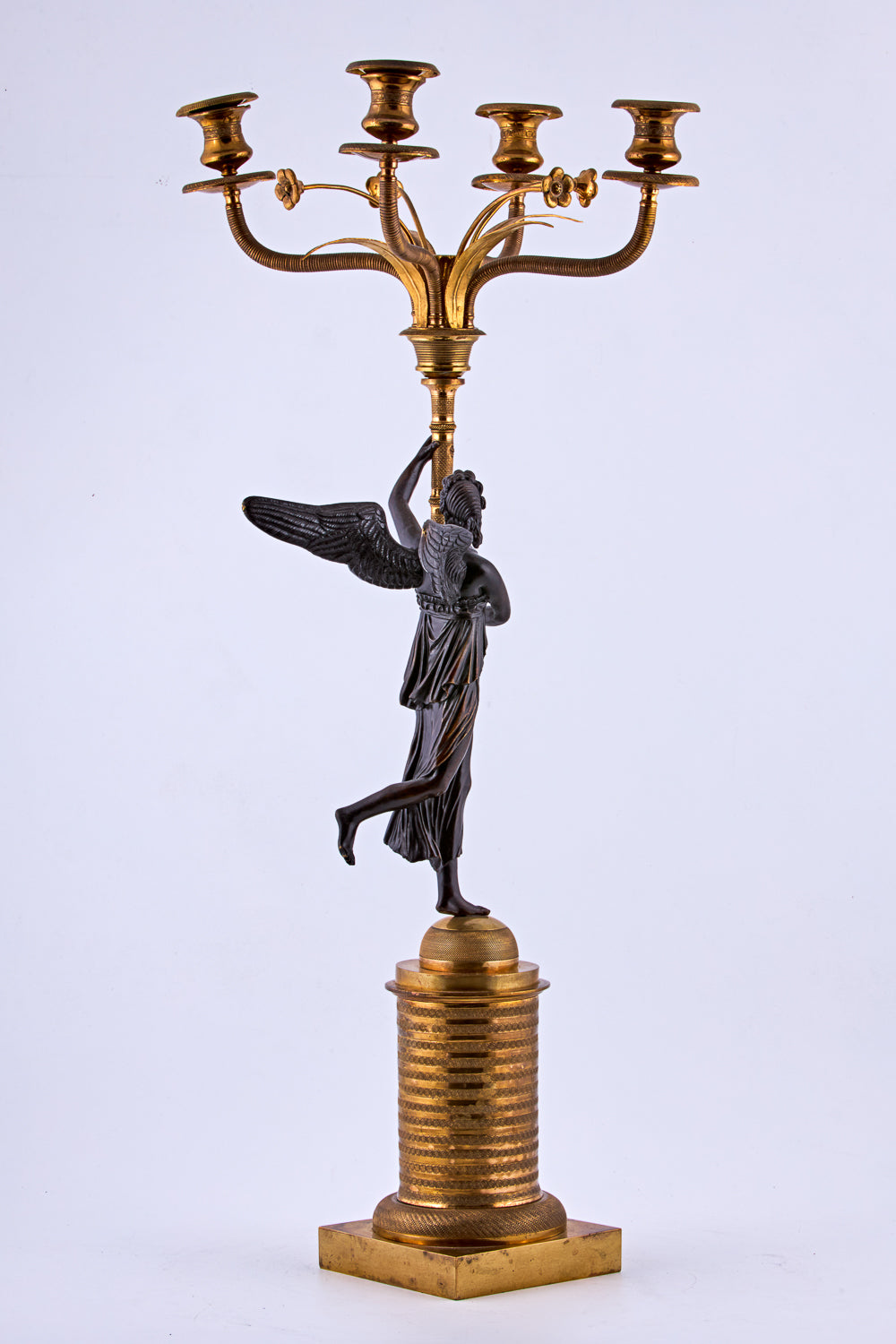 Candelabra from the late 19th century is crafted in bronze with a gold-plated finish
