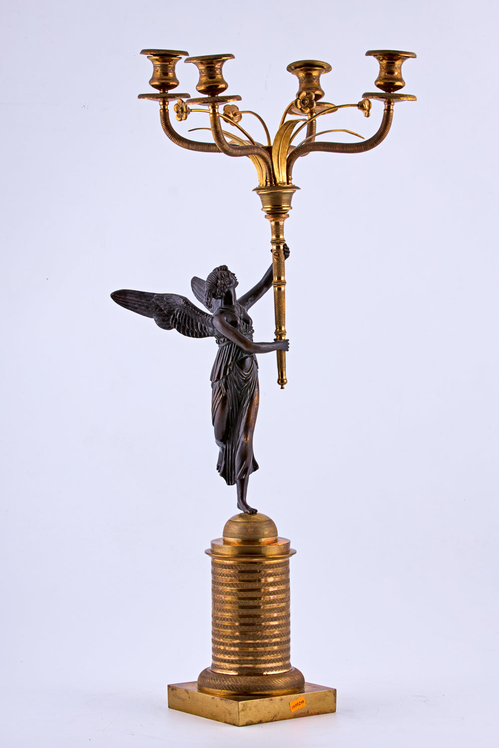 Candelabra from the late 19th century is crafted in bronze with a gold-plated finish