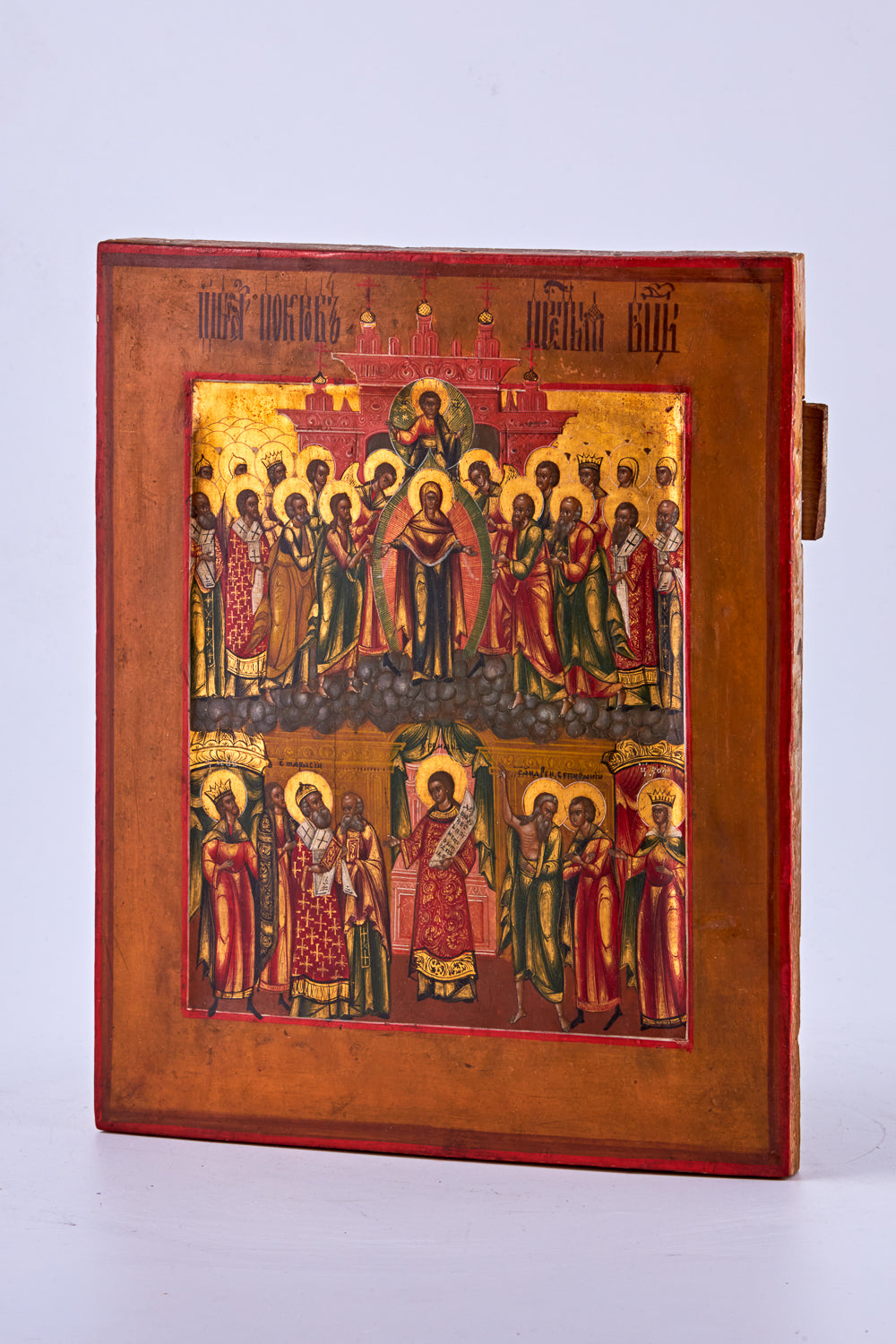 A hand-painted icon of “The Intercession of the Theotokos,” crafted with tempera and gold on birch wood